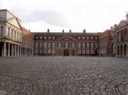 Dublin Castle. The Upper Courtyard. On the left is the state entrance and the Viceregal Apartments. The Irish Crown Jewels were stolen from the building to the right.