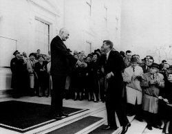 President Dwight D. Eisenhower greets President-elect John F. Kennedy, December 1960.